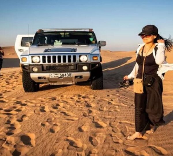 capturing photo with hummer at desert safari dubai