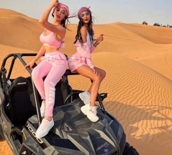 girls enjoying polaris buggy ride at desert safari